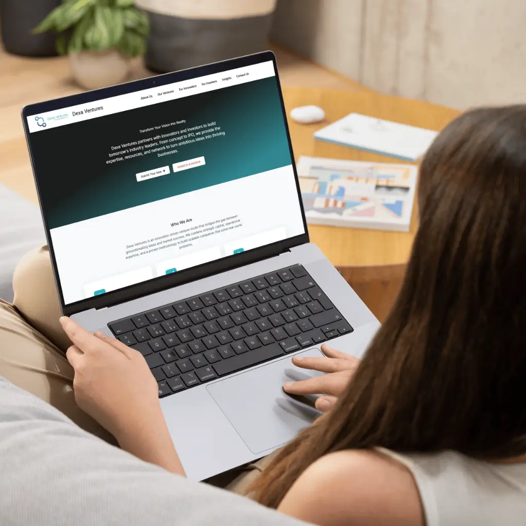 Person using laptop on couch | dexaventure.com | Develop by RankDigital